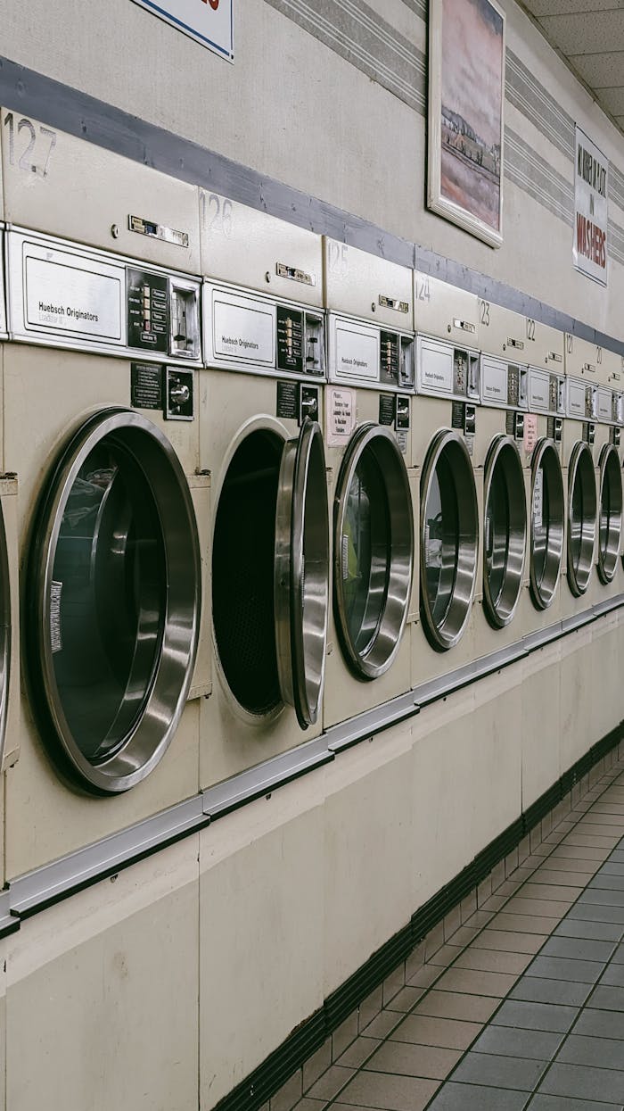 services-03 A classic laundromat in Chicago featuring a row of vintage washing machines.